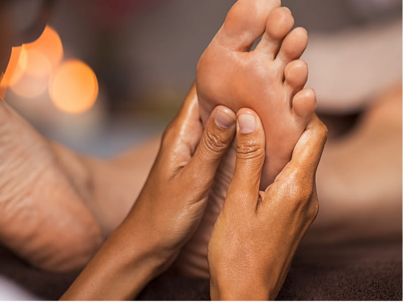 A relaxing scene of a foot massage in a spa in Siem Reap, a soothing treatment after a day of exploring the ancient wonders of Angkor