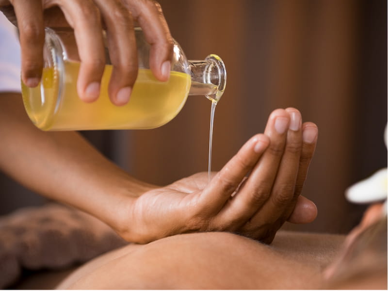 Natural oils or balms are used to enhance the therapeutic effects of a traditional Khmer massage.